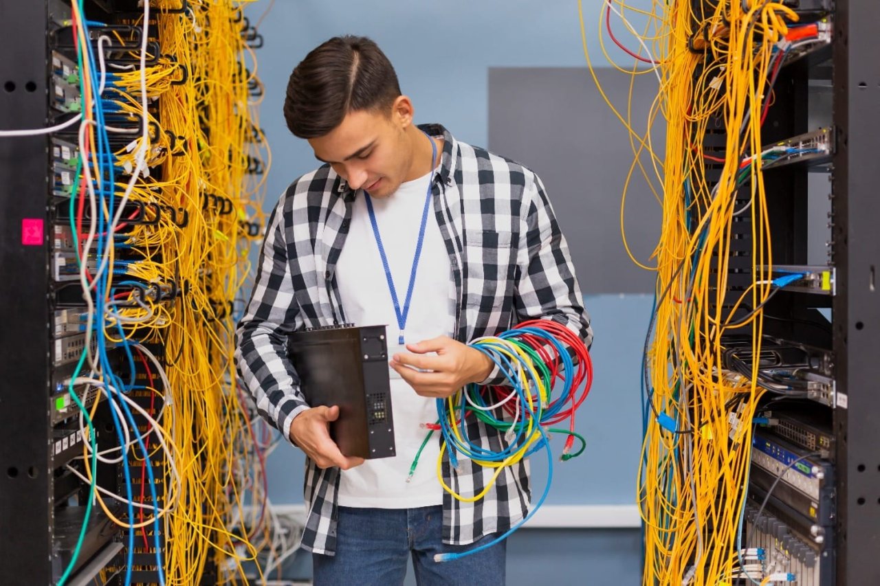 Young Network Engineer Looking Ethernet Switches 1