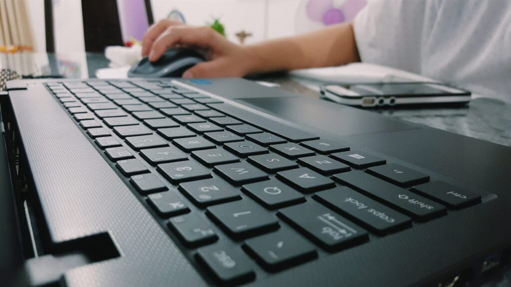 Cropped Image Person Using Laptop