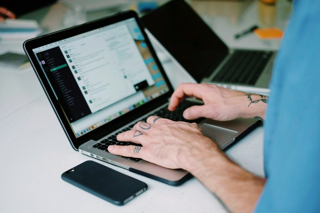 Midsection Man Using Laptop Table