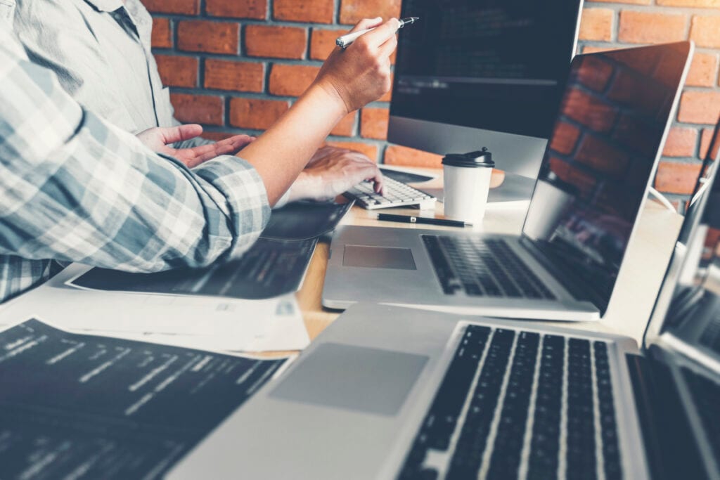 Midsection Programmer Colleague Working Table